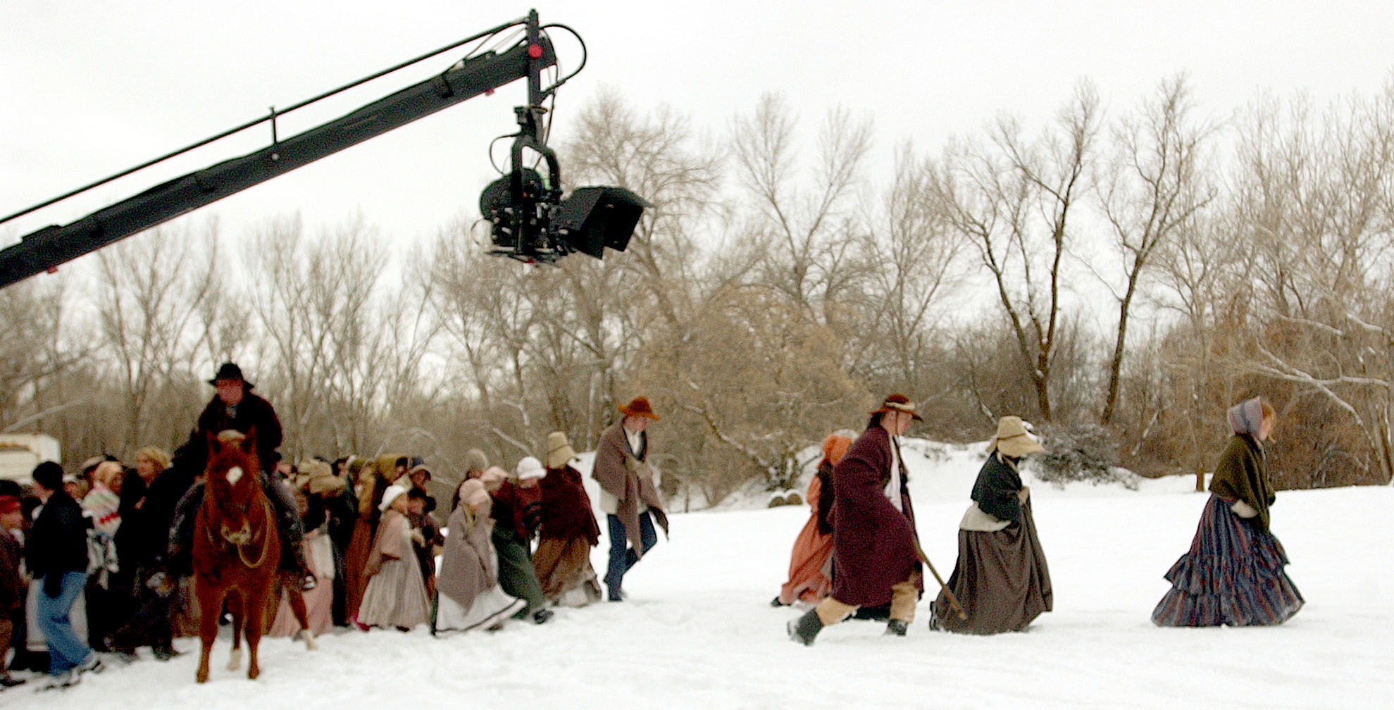 Extras Braving the inclement weather on the set of Richard Dutcher's film "The Prophet" at Fort Buenaventura in Ogden. photo: michael brandy.  1/19/02