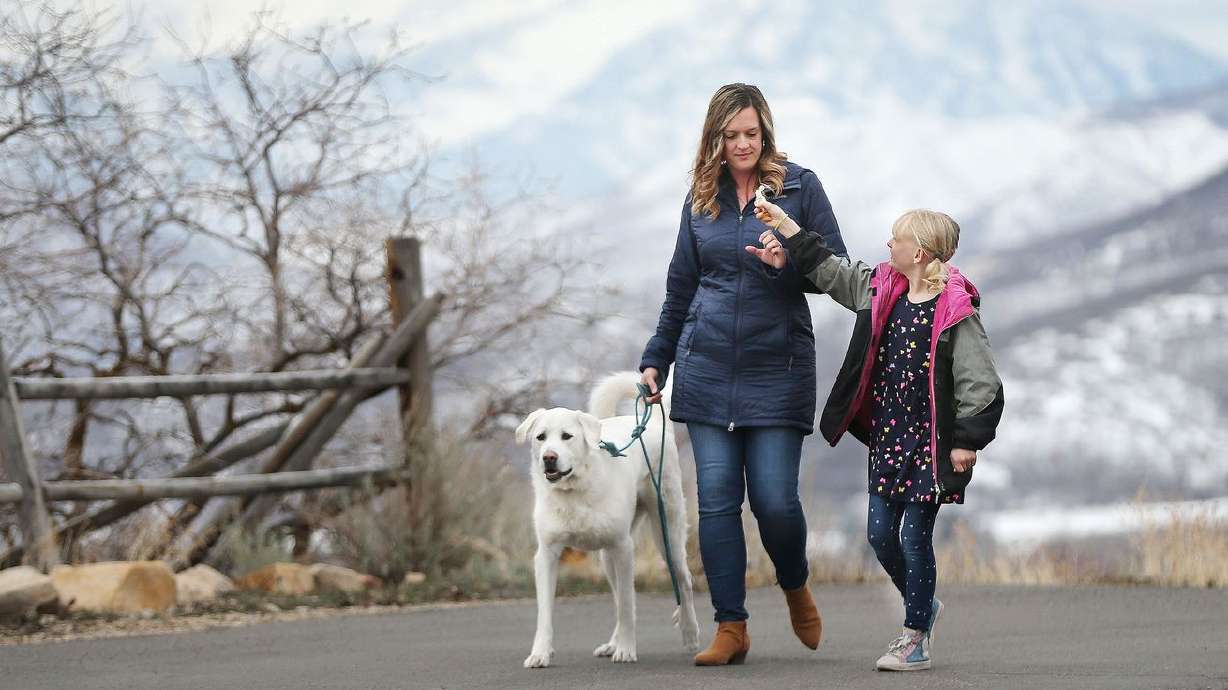 Amelia Wilcox walks with daughter Sierra, 9, and dog
Layla near their home in Midway on Friday, March 12, 2021. Women
Tech Council is bringing together women across the tech sector to
put a face and figures to the impact of the female recession on the
state’s economy and tech scene.