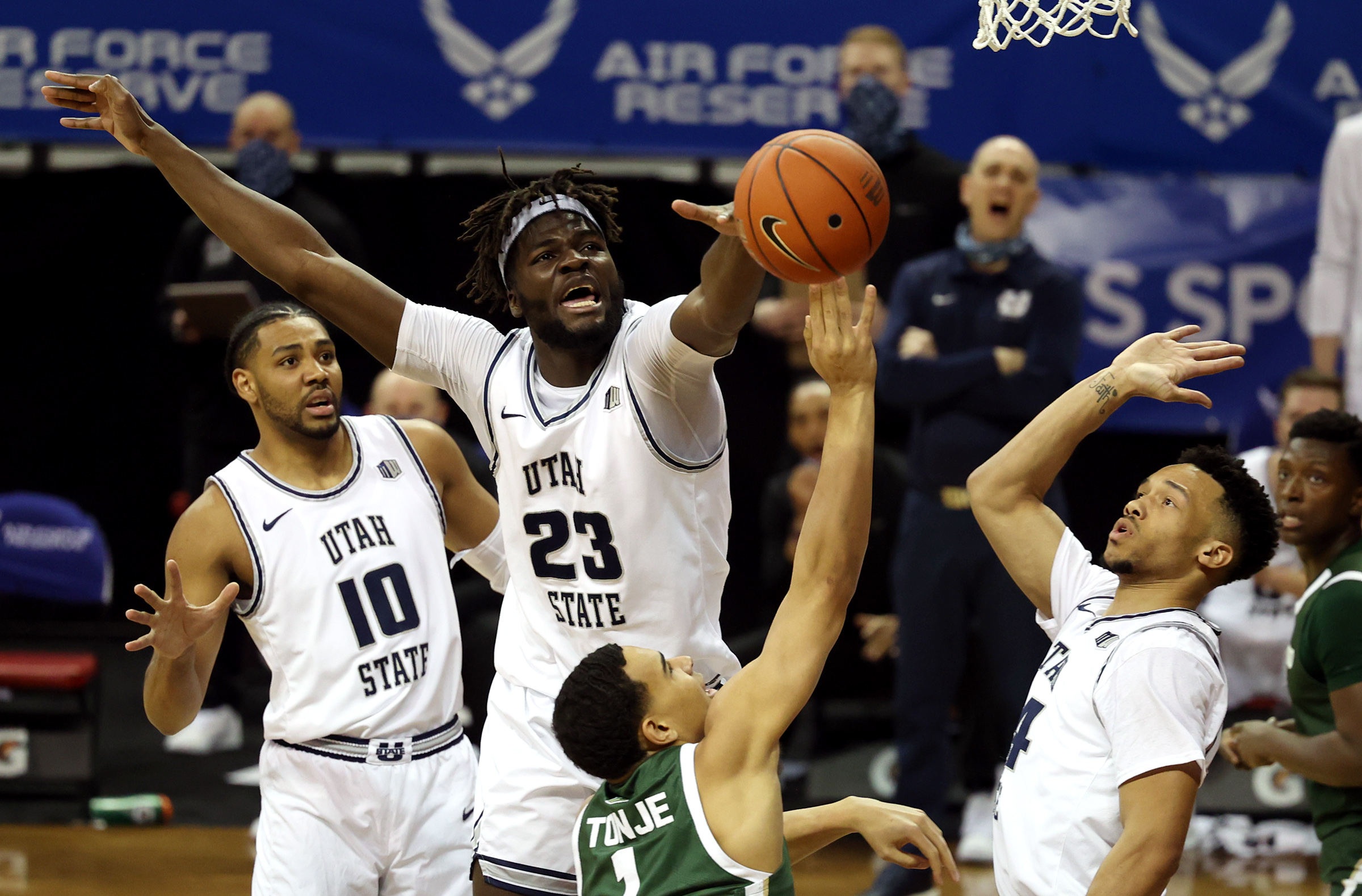 Utah State Aggies center Neemias Queta (23) works to defend Colorado State Rams guard John Tonje (1) as Utah State and Colorado State play in the Mountain West Tournament at the Thomas & Mack Center in Las Vegas on Friday, March 12, 2021.