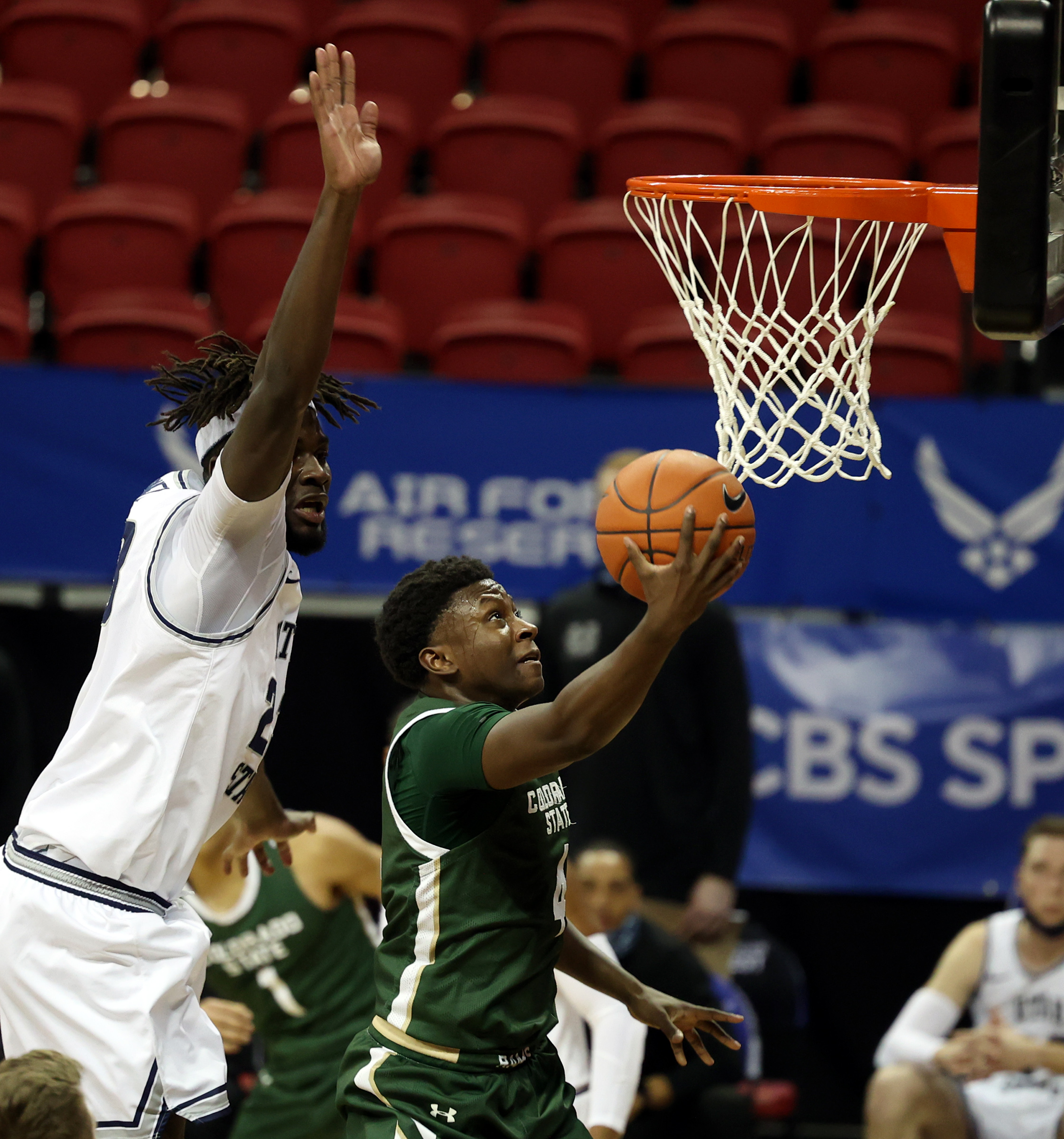Utah State Aggies center Neemias Queta (23) takes a swipe at a shot by Colorado State Rams guard Isaiah Stevens (4) as Utah State and Colorado State play in the Mountain West Tournament at the Thomas & Mack Center in Las Vegas on Friday, March 12, 2021.