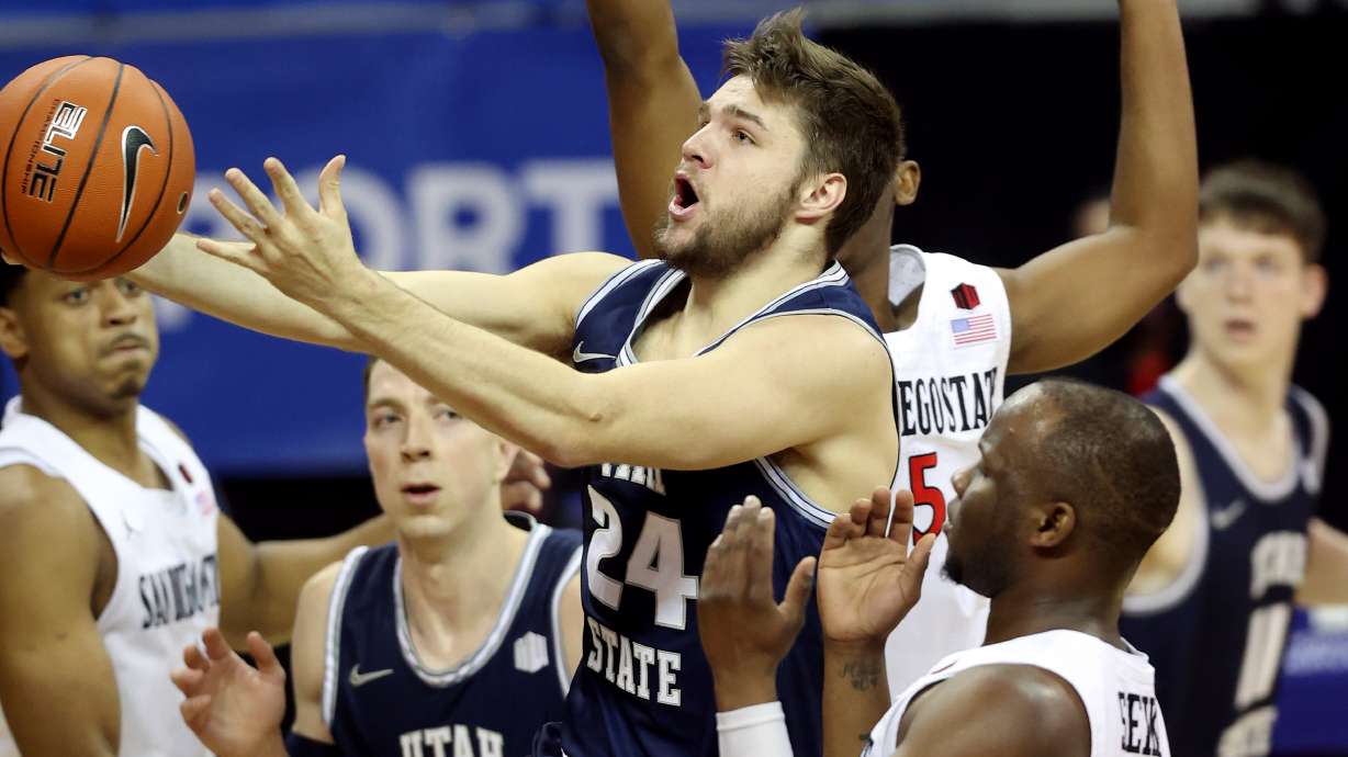 Utah State Aggies guard Rollie Worster (24) drives to the hoop as Utah State and San Diego State play in the championship game of the Mountain West Tournament at the Thomas & Mack Center in Las Vegas on Saturday, March 13, 2021.