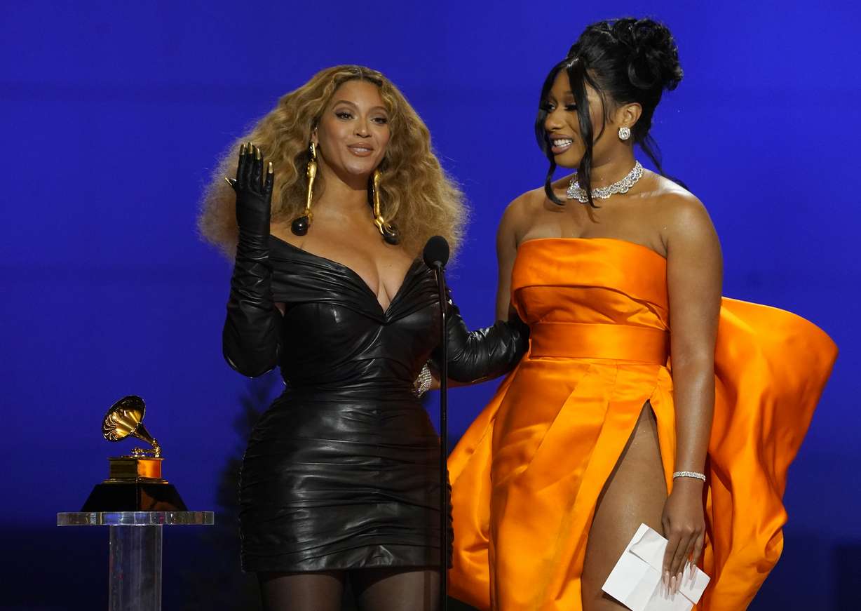 Beyonce, left, and Megan Thee Stallion accept the award for best rap song for "Savage" at the 63rd annual Grammy Awards at the Los Angeles Convention Center on Sunday, March 14, 2021.