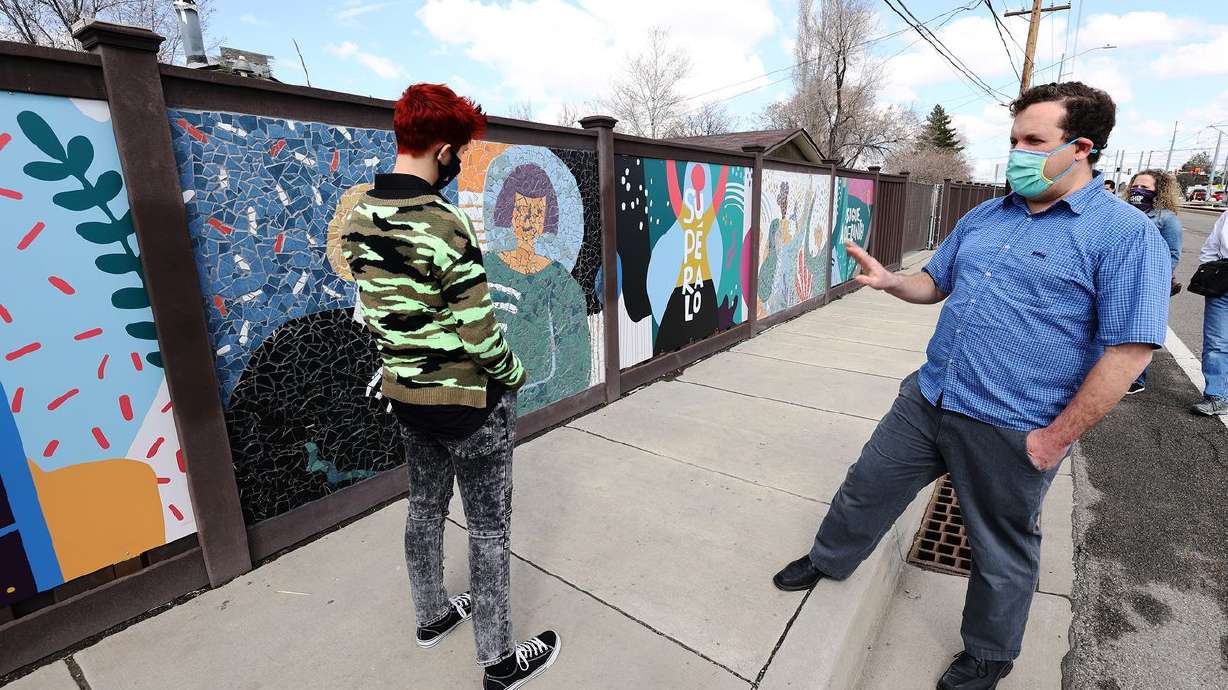 Project assistant Mati Simonds, left, and artist Roger
Whiting, of Community Arts of Utah, stand near their mosaic mural
on 2700 West between 3500 South and 3100 South in West Valley City
on Tuesday, March 16, 2021. Earlier, Gov. Spencer Cox and West
Valley Mayor Ron Bigelow held a bilingual press event at West
Valley City Hall to unveil the mural, dedicated to those who have
taken their own lives, and a media campaign to raise awareness of
mental health and suicide prevention resources available to Utah’s
Latino community.