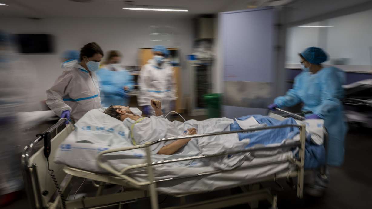 Experts: Virus surge in Europe a cautionary tale for US