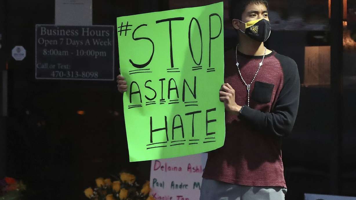 Jesus Estrella, of Kennesaw, Ga., stands outside Youngs
Asian Massage on Wednesday, March 17, 2021, in Acworth, Ga., where
four people were fatally shot Tuesday. The House Judiciary
Subcommittee on the Constitution, Civil Rights and Civil Liberties
heard testimony on violence against Asian Americans.