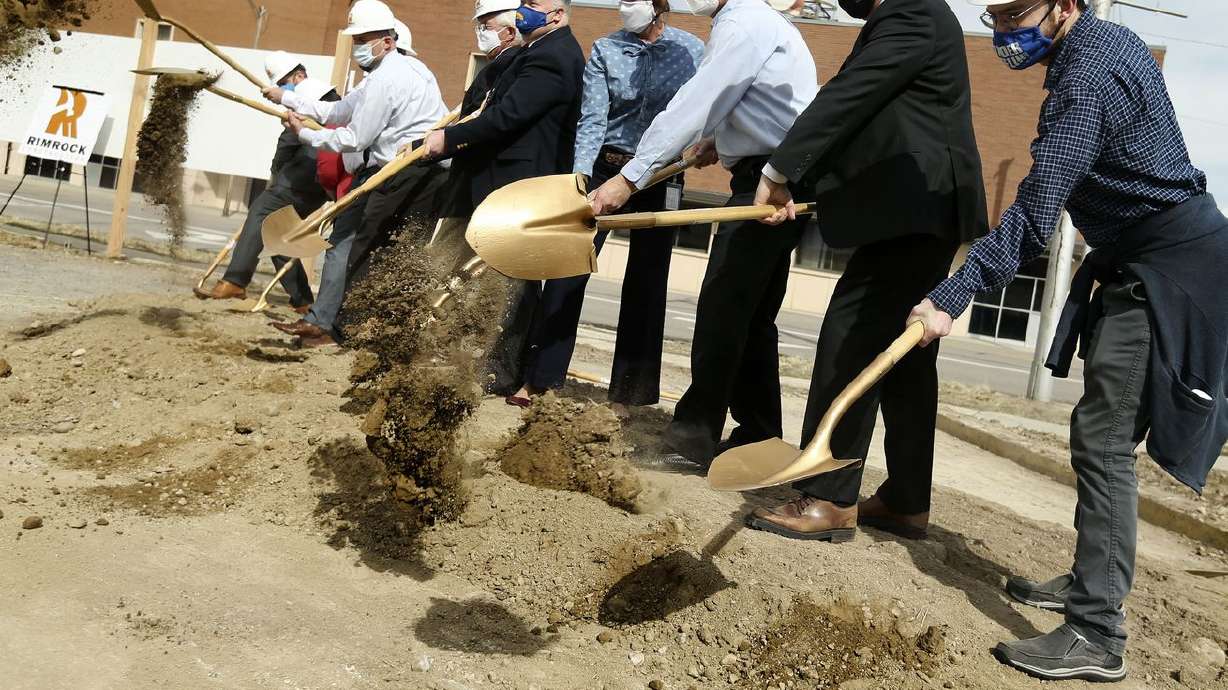 Dignitaries break ground for the 85 North Apartments in
Provo on Thursday, March 18, 2021. The seven-story, 74-unit
building aims to address the shortage of affordable units for
senior citizens, the disabled and adults with
autism. ScenicView Academy student Harrison Peterson, right,
hopes to move into the apartment building after its completion.