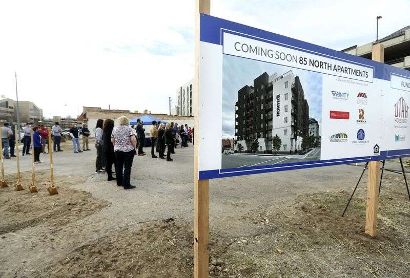 People attend a groundbreaking ceremony for the 85
North Apartments in Provo on Thursday, March 18, 2021. The
seven-story, 74-unit building aims to address the shortage of
affordable units for senior citizens, the disabled and adults with
autism.