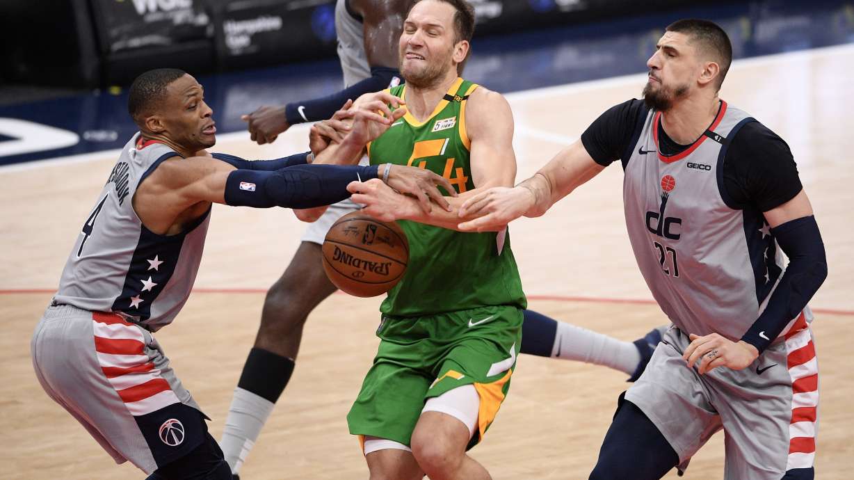 Utah Jazz forward Bojan Bogdanovic (44) loses the ball against Washington Wizards guard Russell Westbrook, left, and center Alex Len (27) during the first half of an NBA basketball game, Thursday, March 18, 2021, in Washington. (AP Photo/Nick Wass)