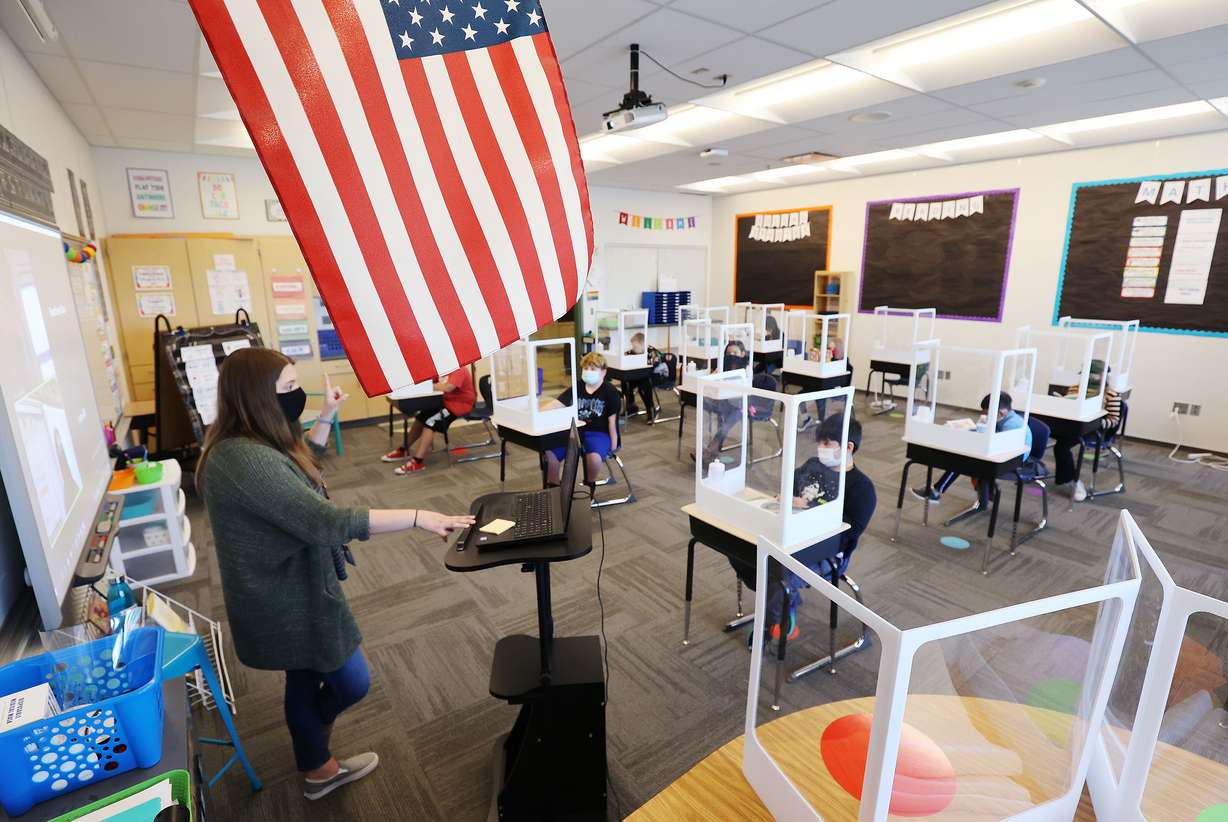 Carlie Moore teaches to socially distanced third graders at Washington Elementary School in Salt Lake City on Friday, March 19, 2021. The Utah HERO Project, a collaboration between University of Utah Health and the David Eccles School of Business announced findings from a major research study that helped inform new Centers for Disease Control and Prevention guidance.