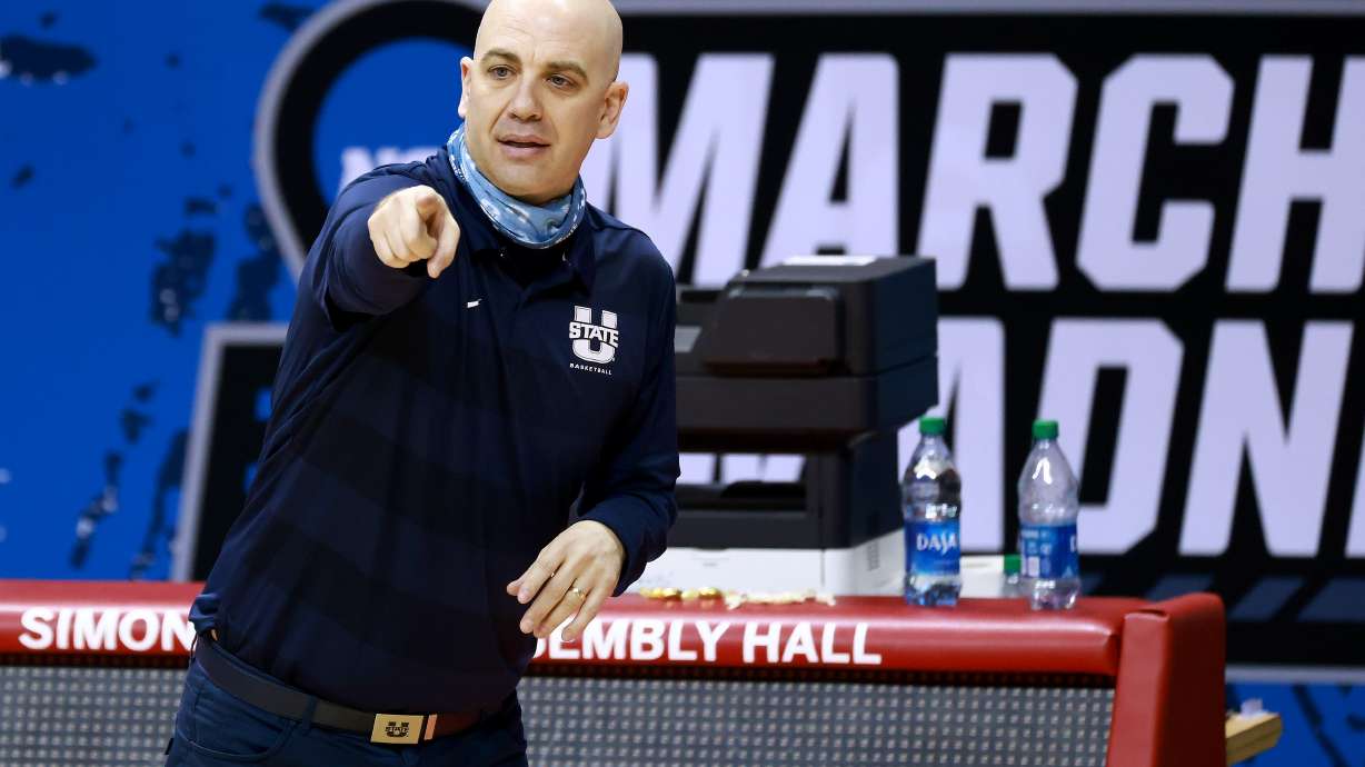 Head coach Craig Smith of the Utah State Aggies directs his team against the Texas Tech Red Raiders in the first round of the 2021 NCAA Division I MenÕs Basketball Tournament held at Simon Skjodt Assembly Hall on March 19, 2021 in Bloomington, Indiana. (Photo by Grant Halverson/NCAA Photos via Getty Images)