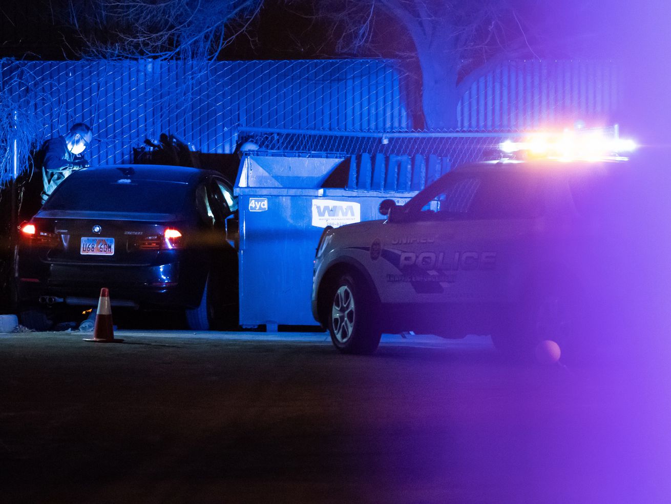 Unified police officers investigate a black BMW sedan
that was involved in a shooting in the area of 5300 West and 5400
South in Kearns on Tuesday, March 9, 2021.