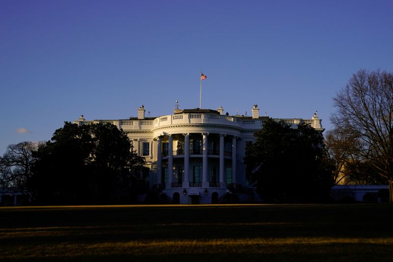 FILE PHOTO: The White House is seen at sunset in Washington, U.S. March 6, 2021. REUTERS/Erin Scott