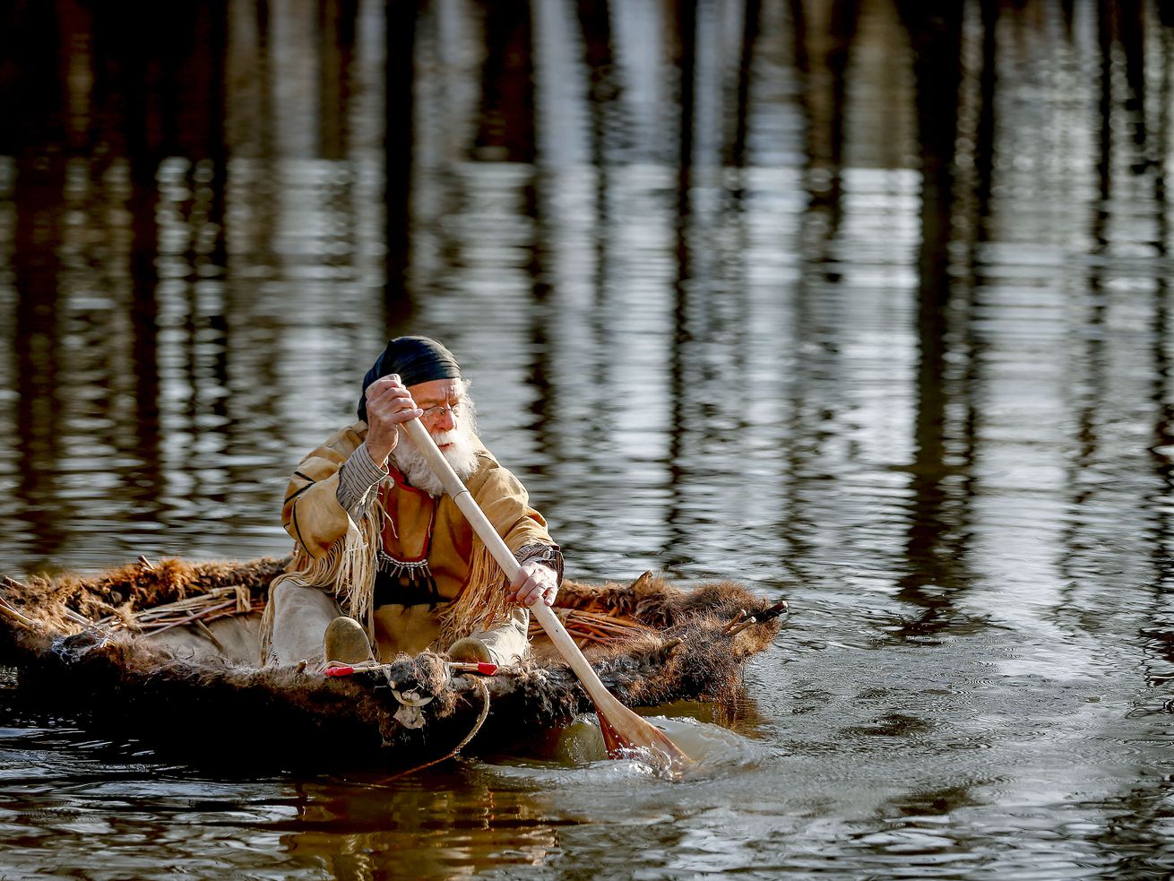 Larry Price paddles a bull boat during a float test at
Fort Buenaventura in Ogden on Wednesday, March 17, 2021. Price and
longtime friend Mark Balliett are planning to float down the Bear
River from Cutler Dam to as close they can get to the Great Salt
Lake in late May to commemorate Jim Bridger’s 1825 trip.