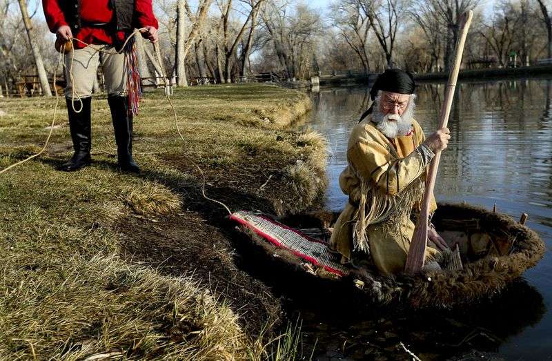 Mark Balliet holds the line as Larry Price pushes off
into the pond for a float test at Fort Buenaventura in Ogden on
Wednesday, March 17, 2021. The men are planning to float down the
Bear River from Cutler Dam to as close they can get to the Great
Salt Lake in late May to commemorate Jim Bridger’s 1825
trip.