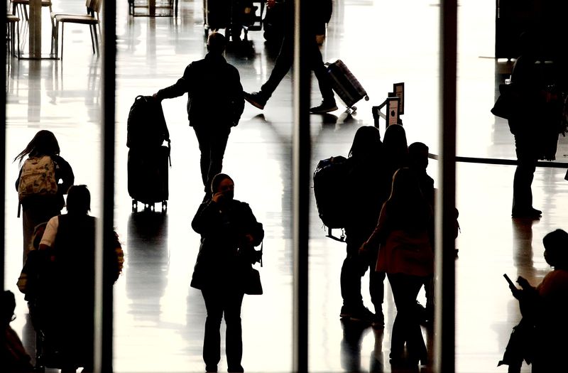 People walk through the Salt Lake City International
Airport on Thursday, March 11, 2021. Nancy Volmer, the airport’s
director of communication and marketing, reported international,
nonstop travel is set to reopen this summer.