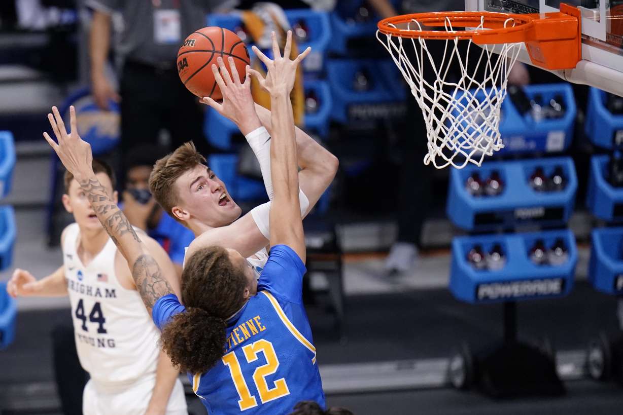 BYU forward Matt Haarms (3) shoots over UCLA forward Mac Etienne (12) during the first half of a first-round game in the NCAA college basketball tournament at Hinkle Fieldhouse in Indianapolis, Saturday, March 20, 2021. (AP Photo/AJ Mast)