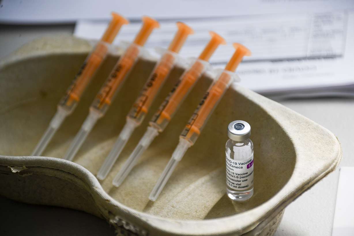 A vial and syringes of the AstraZeneca COVID-19 vaccine, at the Guru Nanak Gurdwara Sikh temple, on the day the first Vaisakhi Vaccine Clinic is launched, in Luton, England, Sunday, March 21, 2021. (AP Photo/Alberto Pezzali)