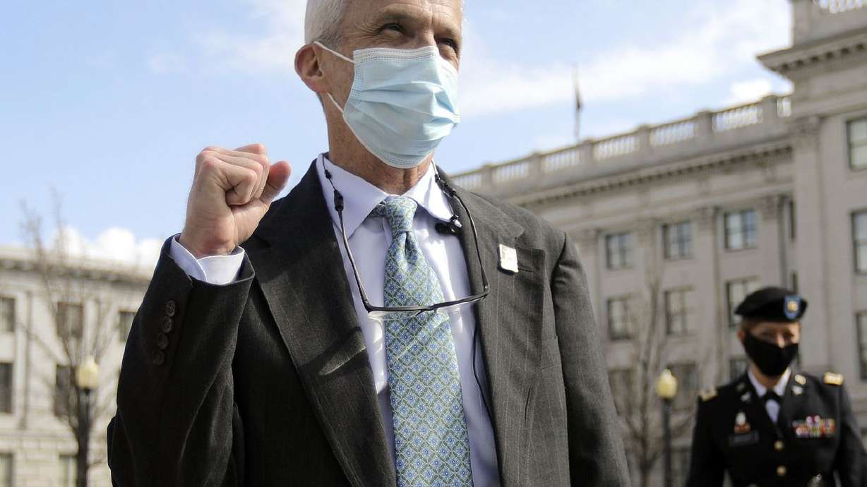 Dr. John Mitchell says "Go Army!” after signing a
commissioning document to enter into the U.S. Army Reserves at the
rank of colonel outside of the Capitol in Salt Lake City on
Wednesday, March 17, 2021. Mitchell previously served 20 years in
the Army before working as a cardiothoracic surgeon with
Intermountain Healthcare at Utah Valley Hospital.