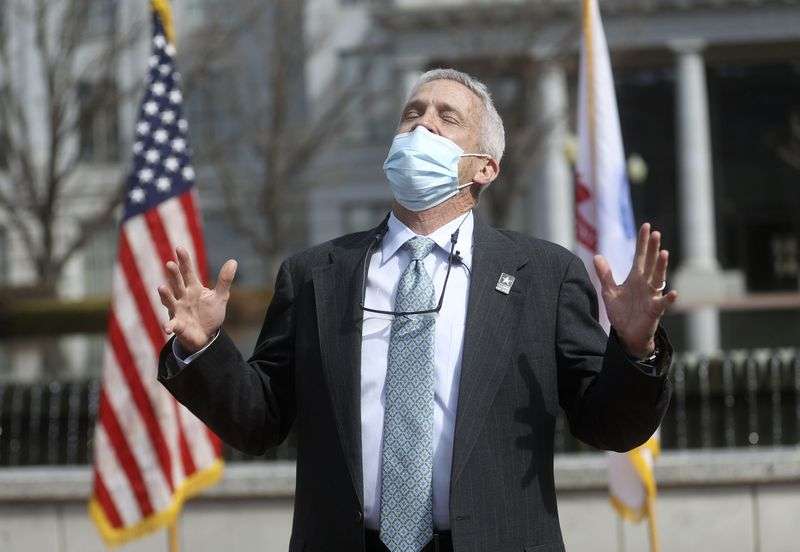 Dr. John Mitchell gets emotional while talking to
family, friends and co-workers before he is sworn into the U.S.
Army Reserves as a colonel outside of the Capitol in Salt Lake City
on Wednesday, March 17, 2021. Mitchell previously served 20 years
in the Army before working as a cardiothoracic surgeon with
Intermountain Healthcare at Utah Valley Hospital.