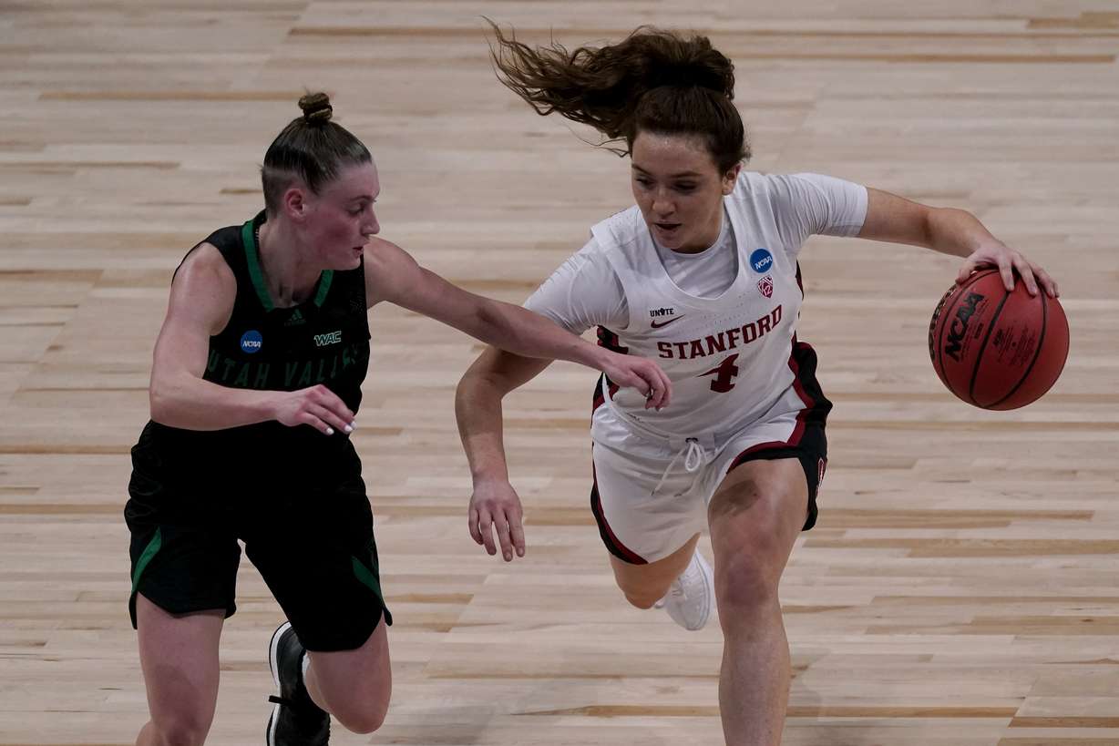 Stanford guard Jana Van Gytenbeek (4) drives under pressure from Utah Valley guard Maria Carvalho (3) during the first half of a college basketball game in the first round of the women's NCAA tournament at the Alamodome in San Antonio, Sunday, March 21, 2021.