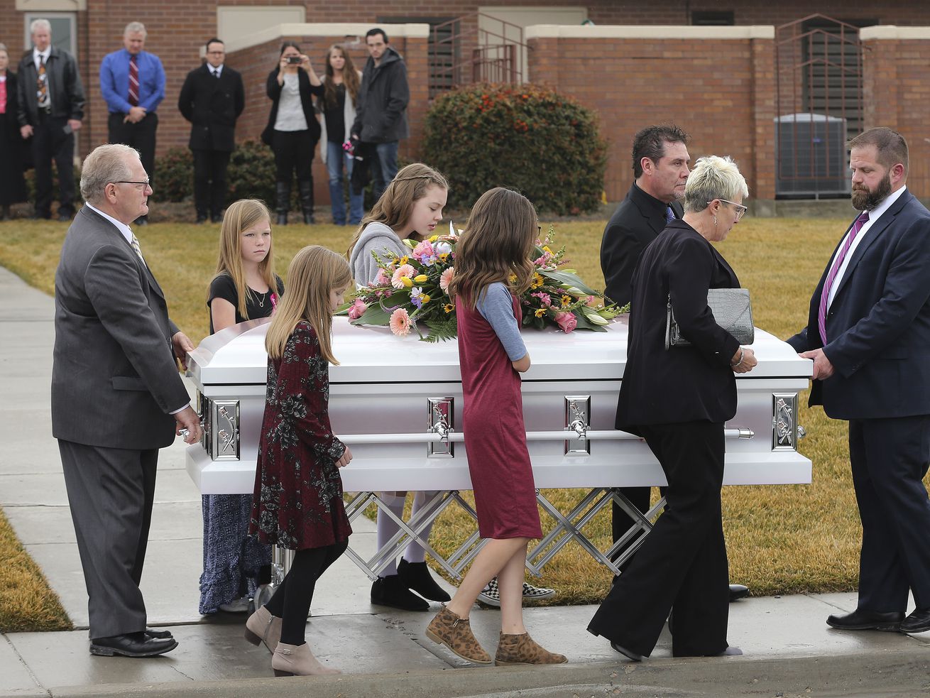 Pallbearers walk with Milan Haynie’s casket during
the funeral for four members of the Haynie family at the
Grantsville Stake Center of The Church of Jesus Christ of
Latter-day Saints in Grantsville on Jan. 24, 2020. A plea deal is
now in the works for CJ Haney, now 17, who is charged with
murdering his mother and three siblings in their Grantsville home.