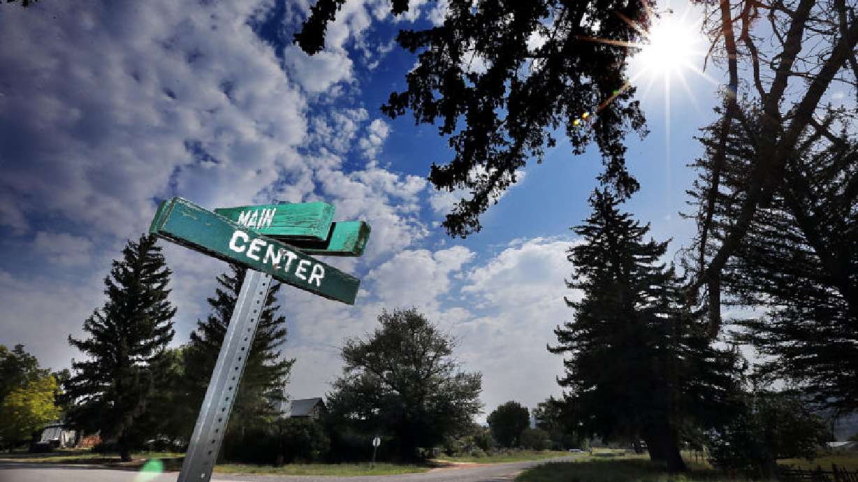 Painted wooden signs mark Main Street and Center Street in Alton, Kane County, Thursday, Aug. 20, 2015.