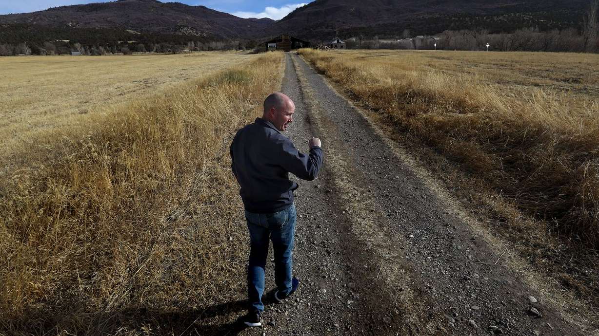 Now-Gov. Spencer Cox walks on his family’s farmland in
Fairview, Sanpete County, on Dec. 9, 2020. Cox signed 56 more bills
Monday, including several related to investments in rural Utah.