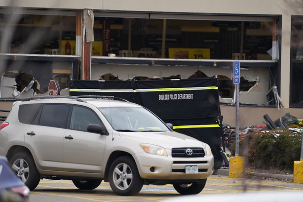 Windows appear damaged at a King Soopers grocery store where a shooting took place Monday, March 22, 2021, in Boulder, Colo.
