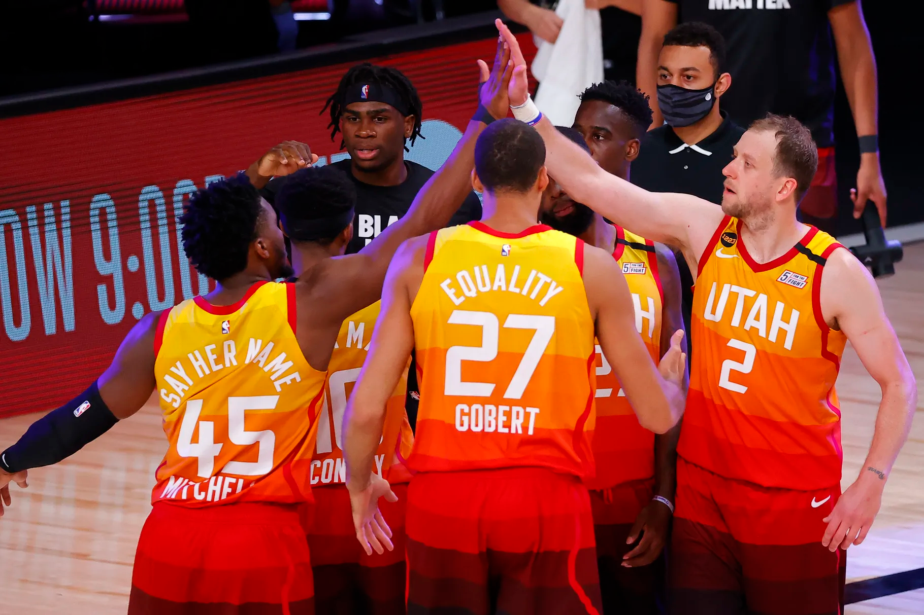 Members of the Utah Jazz celebrate a win against the Denver Nuggets in Game 4 of an NBA basketball first-round playoff series, Sunday, Aug. 23, 2020, in Lake Buena Vista, Fla. The Jazz navigated the first half of the 2021 season impressively, notching the best record in the league, and could be poised to make a run at the title.