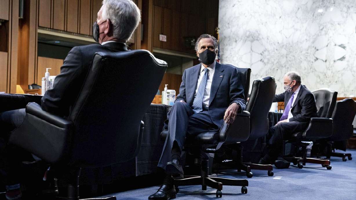 Sen. Mitt Romney, R-Utah, second from left, listens
during a Senate Health, Education, Labor and Pensions Committee
hearing on the federal coronavirus response on Capitol Hill in
Washington on Thursday, March 18, 2021.