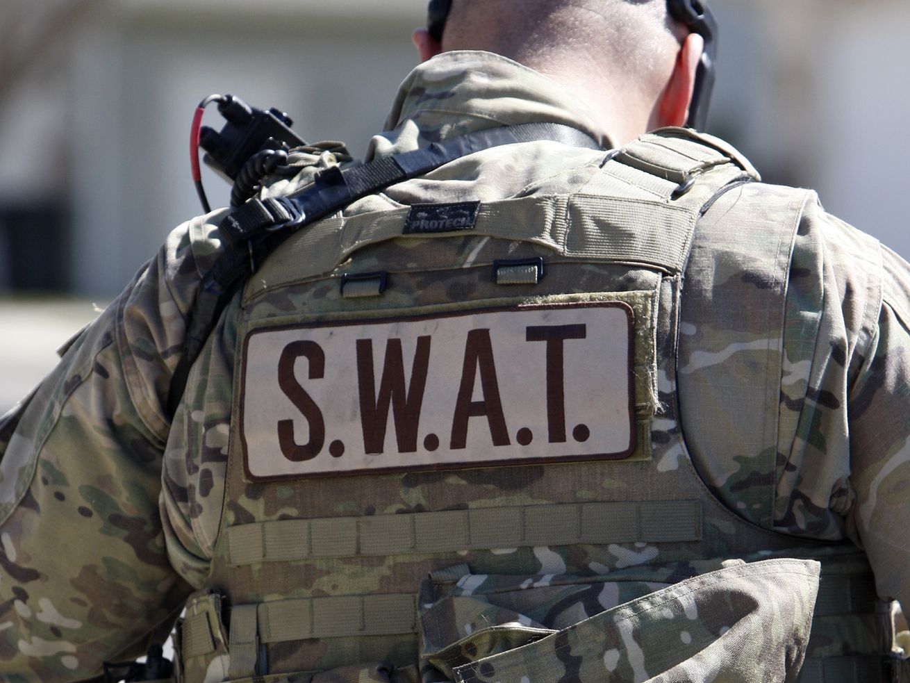 A SWAT team member responds to a Pleasant Grove
incident in this March 20, 2015, photo. On Wednesday, a Pleasant
Grove man was charged with assault on a police officer, illegal
discharge of a firearm and aggravated assault following a six-hour
standoff on March 16 during which he allegedly shot at officers.