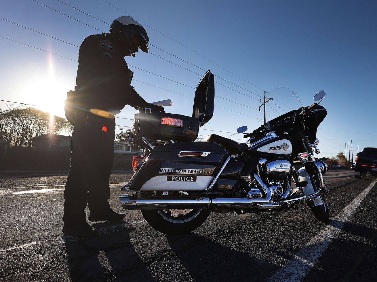 West Valley officer Gary Lipscomb issues a traffic
violation in a school zone in West Valley City on Wednesday, March
24, 2021.
