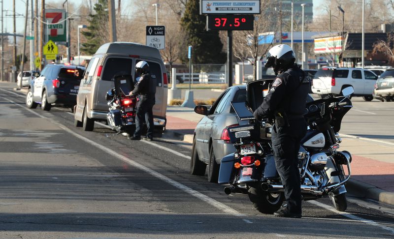 Three motorists are stopped by West Valley police for
traffic violations in a school zone in West Valley City on
Wednesday, March 24, 2021.