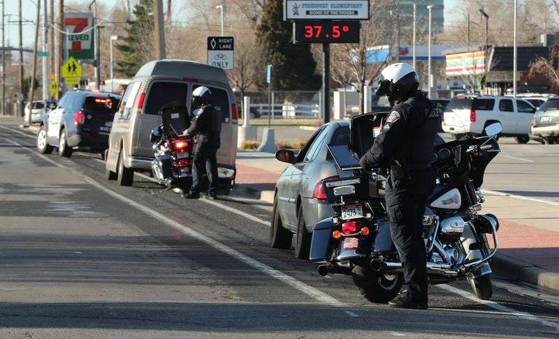 Three motorists are stopped by West Valley police for
traffic violations in a school zone in West Valley City on
Wednesday, March 24, 2021.