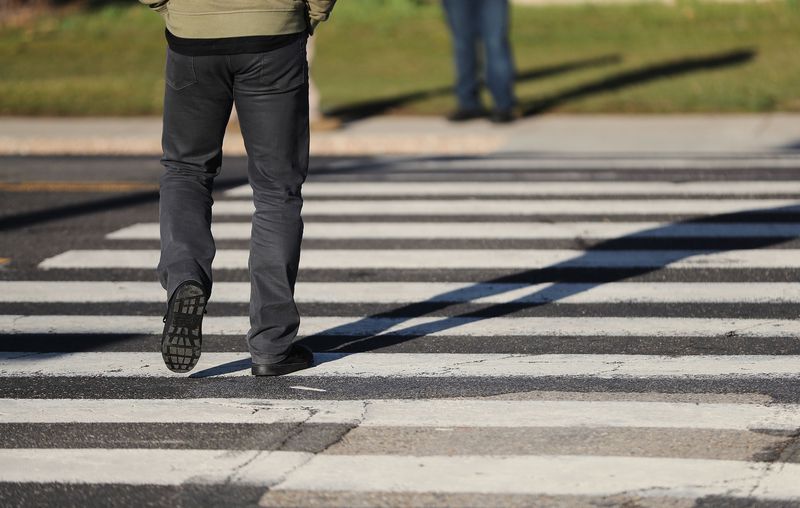 A decoy pedestrian walks in a school crosswalk in West
Valley City on Wednesday, March 24, 2021, as West Valley police
conduct a crosswalk safety operation. A crosswalk that has a
pattern of wide striped lines running from curb to curb — like a
ladder — is a designated school crosswalk. According to state law,
a motorist must wait for a pedestrian to walk all the way across
the street to the opposite sidewalk before proceeding, whether
school is in session or not.