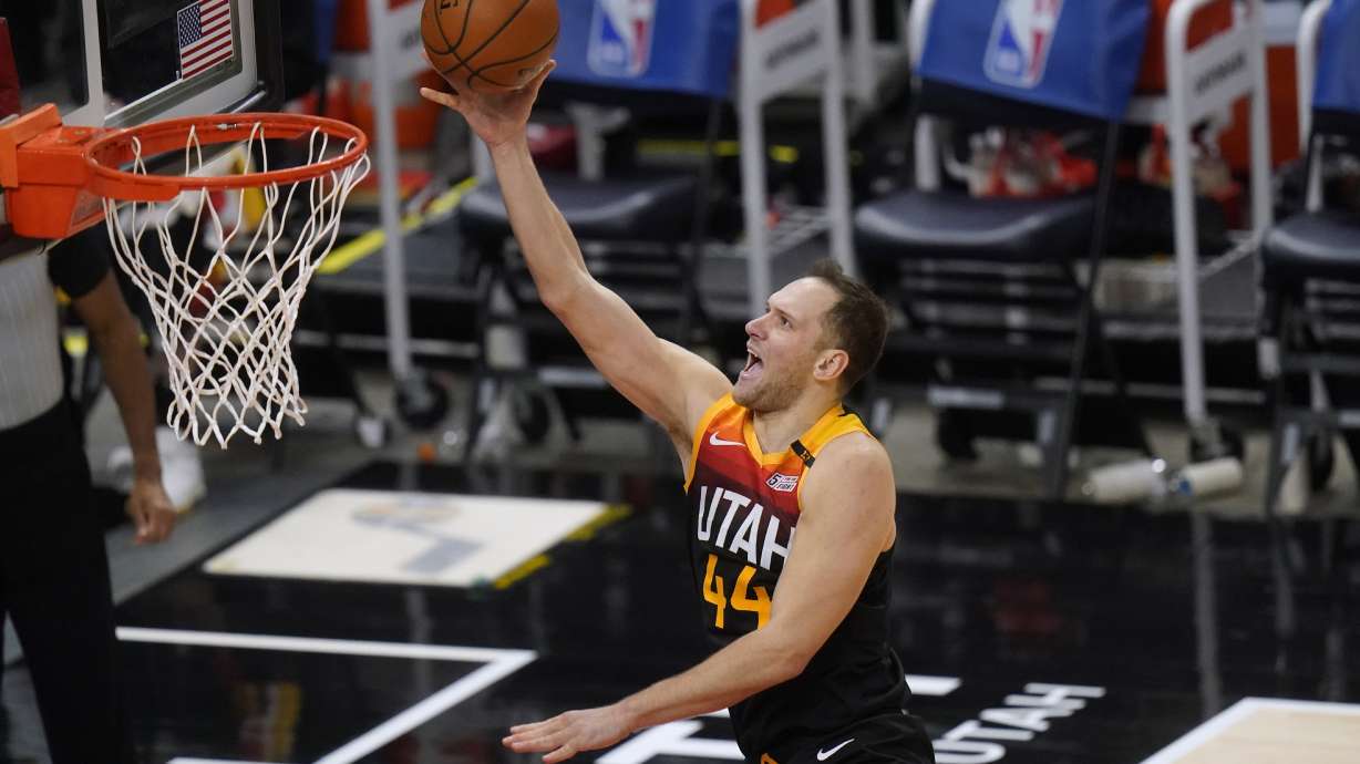 Utah Jazz forward Bojan Bogdanovic lays the ball up during the second half of the team's NBA basketball game against the Dallas Mavericks on Friday, Jan. 29, 2021, in Salt Lake City. (AP Photo/Rick Bowmer)