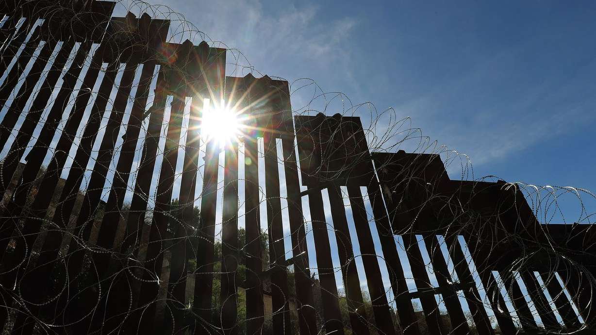 Sun shines through the U.S.-Mexico border wall in
Nogales, Arizona, on Feb. 12, 2019. A day after condemning the
Biden administration for causing a crisis on the U.S. border with
Mexico, Sen. Mike Lee plans to travel to the Southwest to get a
firsthand look at the surge migrants seeking asylum.