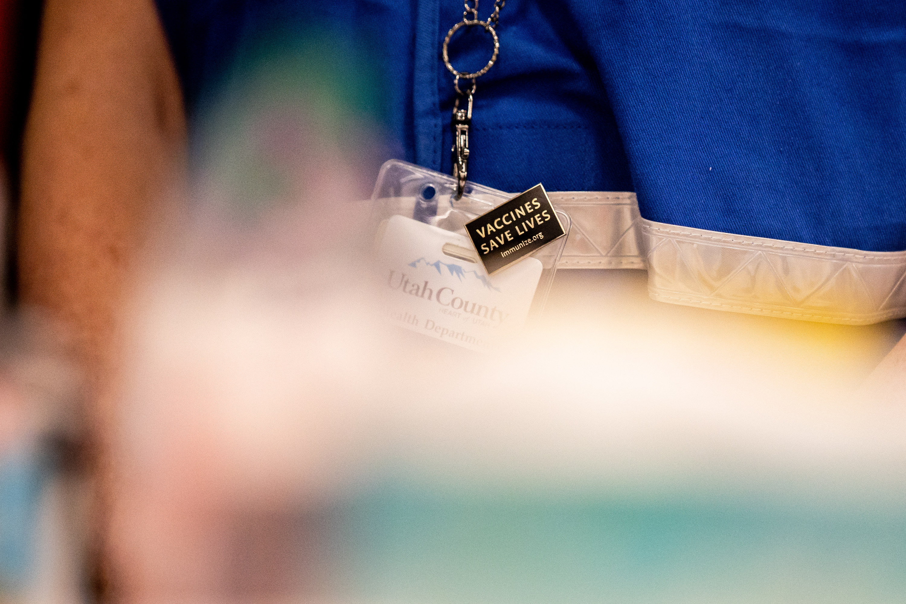 Nurse Amy Engle wears a pin that reads â??Vaccines save livesâ? at a COVID-19 vaccination site run by the Utah County Health Department in Spanish Fork on Thursday, March 25, 2021.