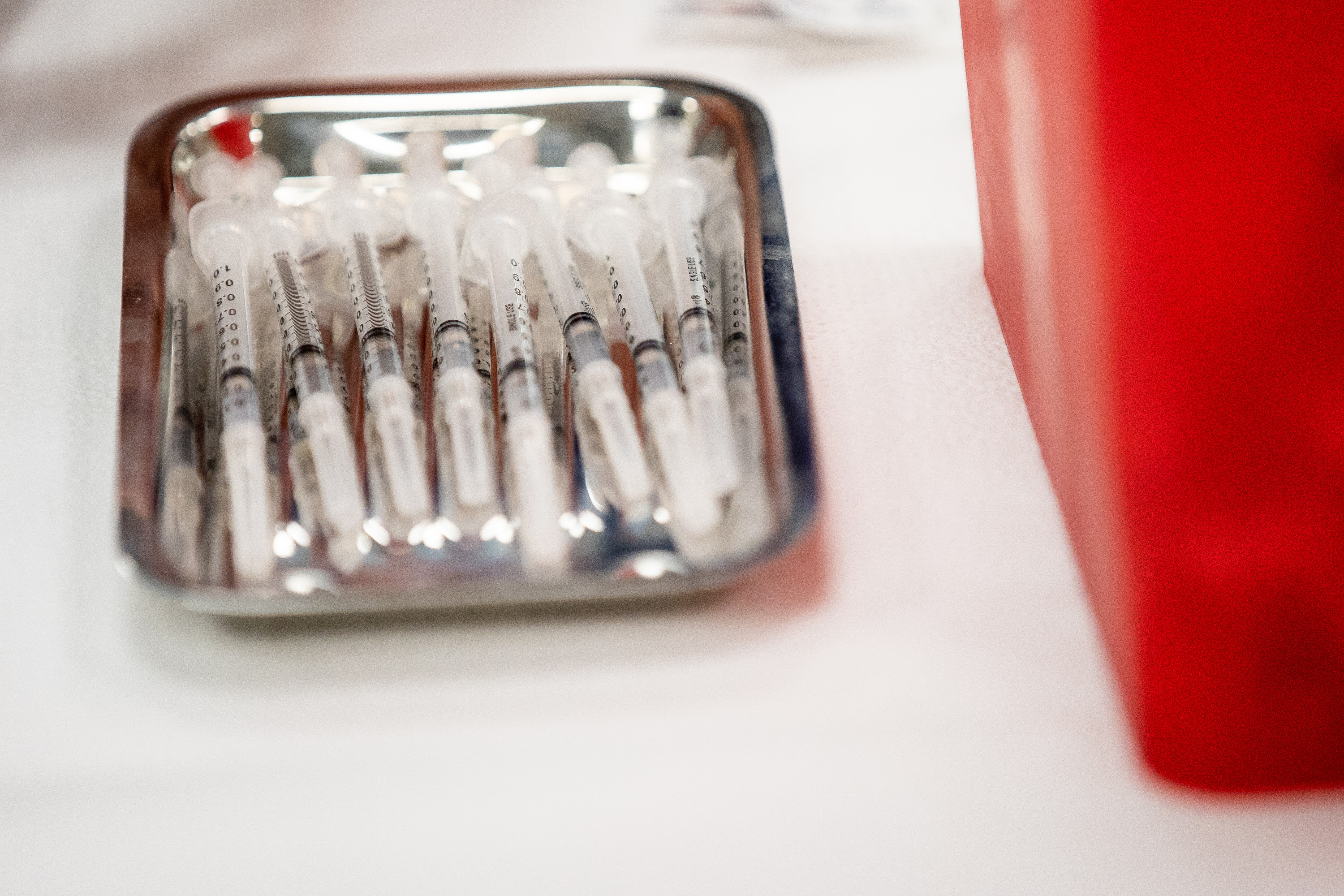 Syringes containing doses of the Pfizer-BioNTech COVID-19 vaccine await patients at a vaccination site run by the Utah County Health Department in Spanish Fork on Thursday, March 25, 2021. Utah reported 325 new COVID-19 cases Friday and two more deaths.