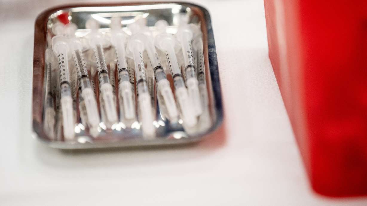 Syringes containing doses of the Pfizer-BioNTech COVID-19 vaccine await patients at a vaccination site run by the Utah County Health Department in Spanish Fork on Thursday, March 25, 2021.