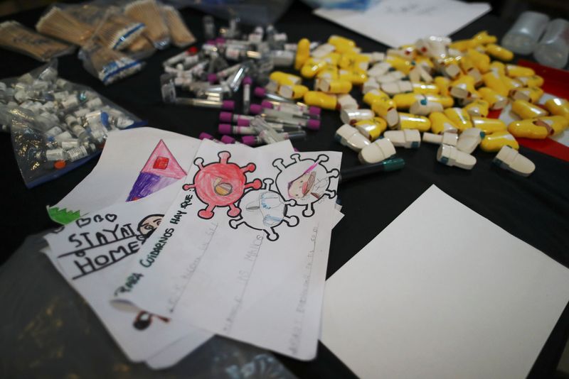 Drawings and medical supplies that will be part of the "Museum of the After" are pictured at the workshop of Argentine artist Marcelo Toledo in Buenos Aires, Argentina March 4, 2021. REUTERS/Agustin Marcarian