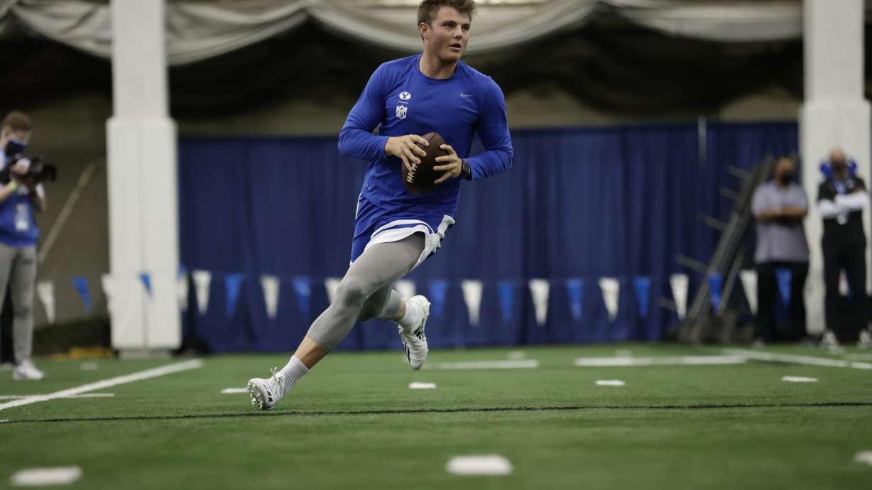 BYU quarterback Zach Wilson drops back to pass during BYU's pro day, Friday, March 26, 2021 in Provo.
