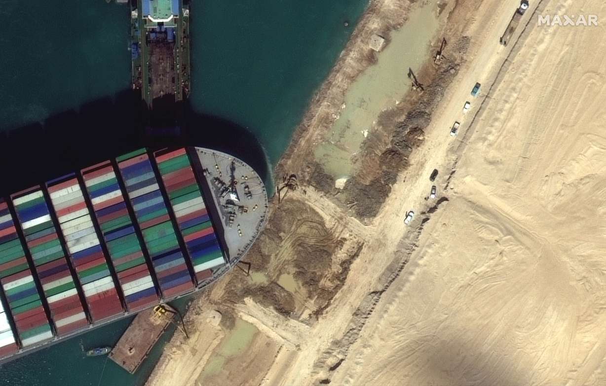 This satellite image from Maxar Technologies shows the cargo ship MV Ever Given stuck in the Suez Canal near Suez, Egypt, Saturday, March 27, 2021.