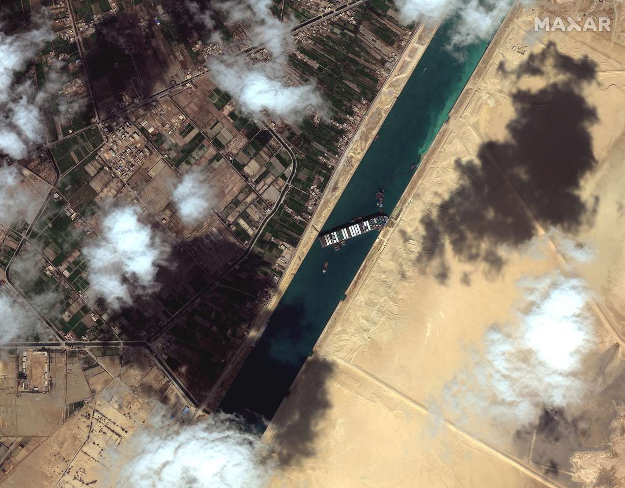 This satellite image from Maxar Technologies shows the cargo ship MV Ever Given stuck in the Suez Canal near Suez, Egypt, Saturday, March 27, 2021.