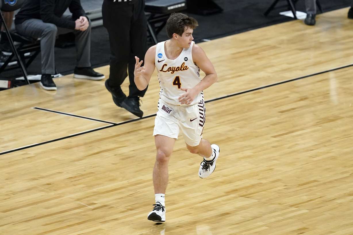 Loyola Chicago guard Braden Norris celebrates after making a 3-point basket during the first half of a Sweet 16 game against Oregon State in the NCAA men's college basketball tournament at Bankers Life Fieldhouse, March 27, 2021. After both teams had games cancelled, the Ramblers and San Francisco scheduled a last-minute game for Thursday at Salt Lake Community College.