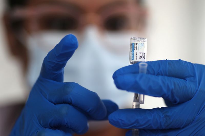 FILE PHOTO: A nurse draws from a vial of Johnson & Johnson coronavirus disease (COVID-19) vaccine, in Los Angeles, California, U.S., March 25, 2021. REUTERS/Lucy Nicholson