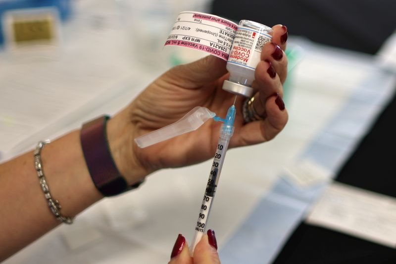 FILE PHOTO: A nurse draws a Moderna coronavirus disease (COVID-19) vaccine, in Los Angeles, California, U.S., March 12, 2021. REUTERS/Lucy Nicholson