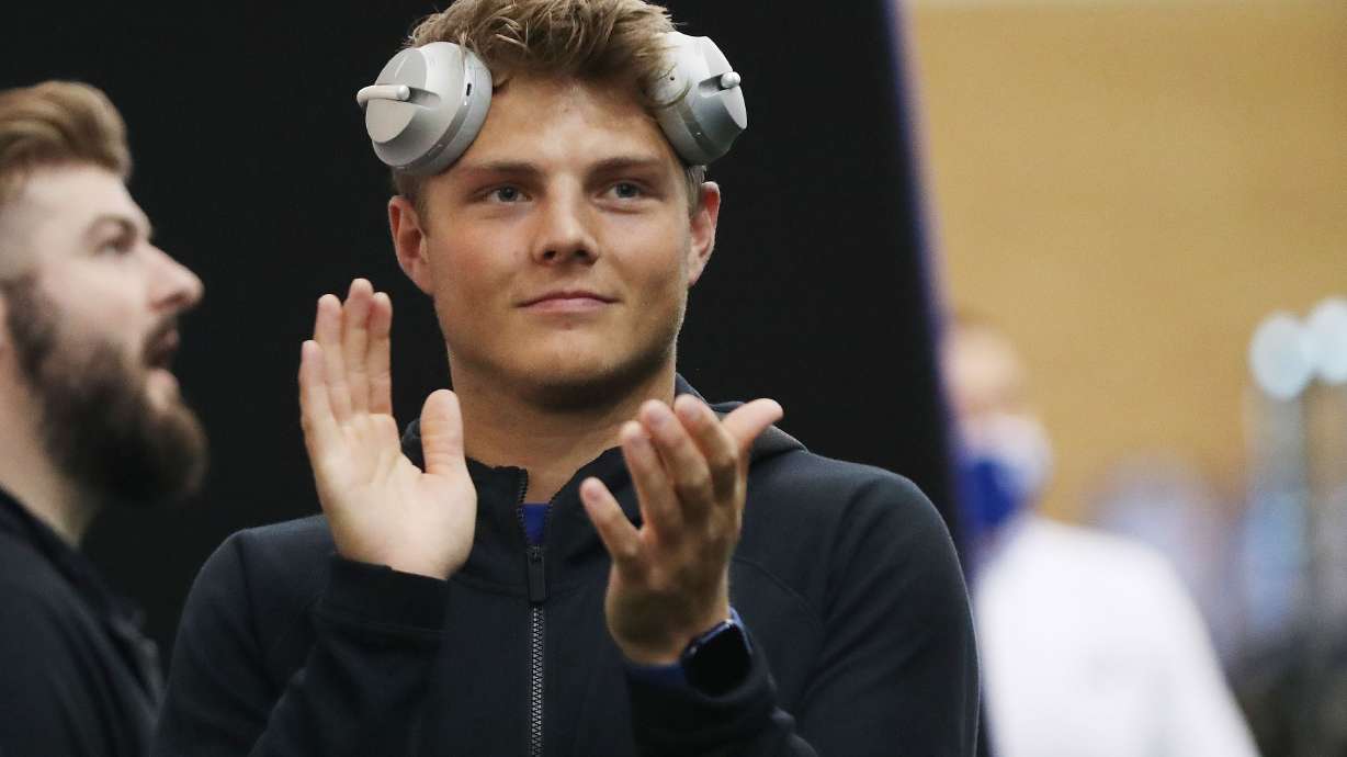 BYU's Zach Wilson applauds teammates as they participate in pro day in Provo on Friday, March 26, 2021.