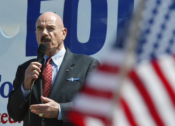 FILE - In this Saturday, April 12, 2003, file photo, talk radio host G. Gordon Liddy speaks at a rally for troops in Washington. In Washington, 10 blocks from an anti-war demonstration, supporters of the war effort drew thousands to their own rally. Liddy, a mastermind of the Watergate burglary and a radio talk show host after emerging from prison, has died at age 90. His son, Thomas Liddy, confirmed the death Tuesday, March 30, 2021, but did not reveal the cause.