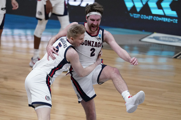 Gonzaga forward Drew Timme (2) celebrates with Gonzaga guard Martynas Arlauskas (5) after an Elite 8 game against Southern California in the NCAA men's college basketball tournament at Lucas Oil Stadium, Tuesday, March 30, 2021, in Indianapolis. Gonzaga won 85-66.